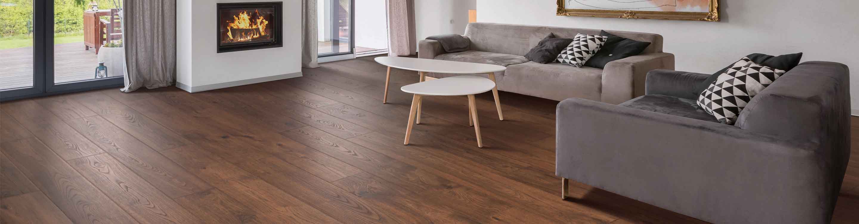 Laminate flooring in Greenwood living room with furniture and fireplace